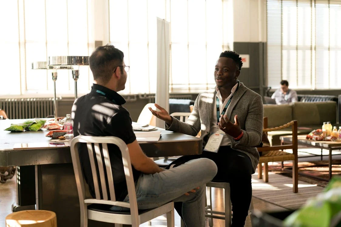 A business coaching session building rapport and connection.